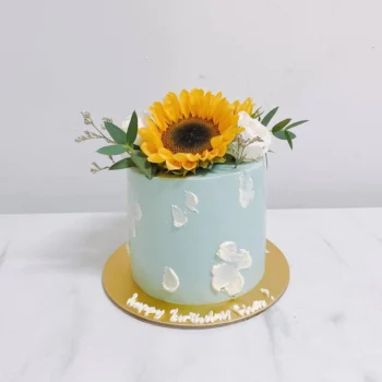 Baby Blue Painted Sunflower Cake